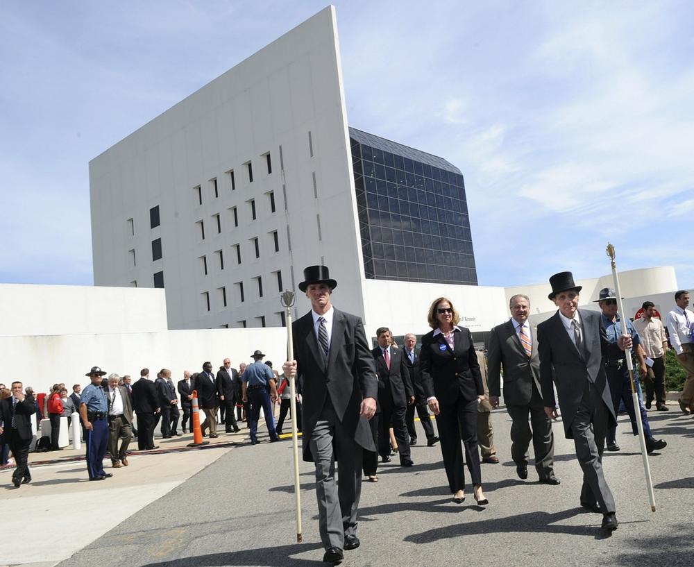 Members of the Massachusetts Legislature are led by the Sergeants at Arms as they walk away from the John F. Kennedy Presidential Library after paying their respects to Sen. Edward M. Kennedy on Friday morning. (AP)