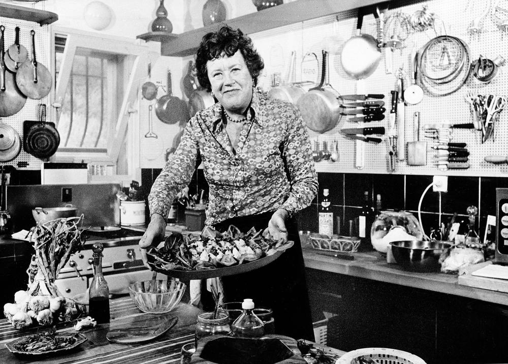 American television chef Julia Child, showing a salade nicoise she prepared in the kitchen of her vacation home in Grasse, southern France, in 1978 (AP)
