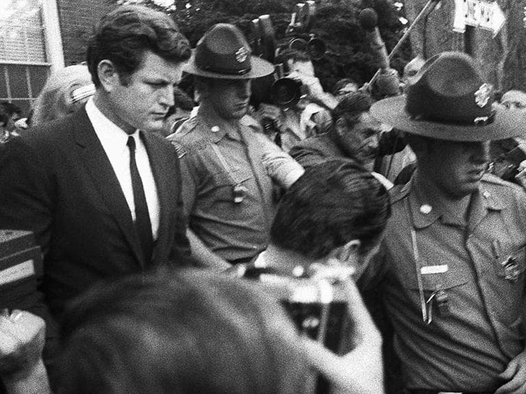 Sen. Edward Kennedy is escorted by troopers as he leaves court July 25, 1969, in Edgartown, Mass., after pleading guilty to a charge of leaving the scene of the accident which killed aide Mary Jo Kopechne. (AP)