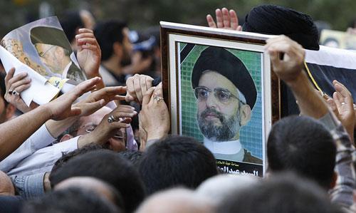 Iranians and Iraqis carry the coffin of Abdul-Aziz al-Hakim, shown in the picture, one of Iraq's most powerful Shiite leaders, in a funeral ceremony in Tehran, Iran, Thursday, Aug. 27, 2009. Abdul-Aziz al-Hakim, the scion of a revered clerical family who channeled rising Shiite Muslim power after the fall of Saddam Hussein to become one of Iraq's most powerful politicians, died Wednesday in Iran, the country that was long his powerful ally. (AP)
