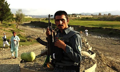 A member of the Afghan National Police stands guard at his post, in Khowst province, east of Kabul, Afghanistan, Thursday, Sept. 3, 2009. (AP)
