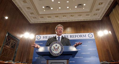 Sen. Max Baucus (D-Mont.), chairman of the Senate Finance Committee, gestures during his news conference on health care legislation, Wednesday, Sept. 16, 2009. (AP)