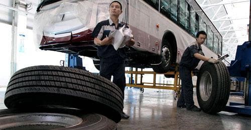 Workers at a Chinese factory in Beijing last month. China strongly opposed President Barack Obama's decision to impose punitive tariffs on imports of car and light truck tires, calling it protectionism that violates World Trade Organization rules. (AP)