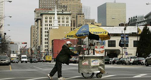 A vendor pushes a hot dog cart at lunchtime in downtown Newark, N.J., on Feb. 15, 2008. (AP)