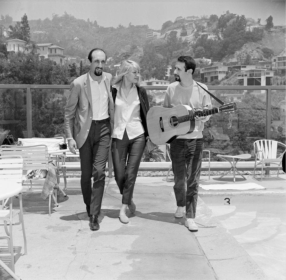 Folk singers, Paul Stookey, left, Mary Travers and Peter Yarrow of Peter, Paul and Mary, pose in Hollywood, Calif., July 6, 1965.  (AP)
