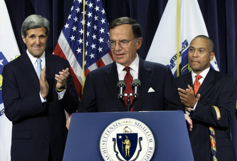 Former Democratic Party chairman Paul G. Kirk Jr. is flanked by Sen. John Kerry, D-Mass., left, and Mass. Gov. Deval Patrick, during a news conference at the State House on Thursday. (Elise Amendola/AP)