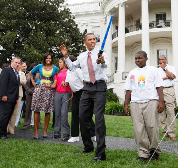 In this Sept. 16 file photo, President Obama uses a light saber as he watches a fencing demonstration at an event supporting Chicago&#039;s 2016 host city Olympic bid on the South Lawn of the White House. (AP)