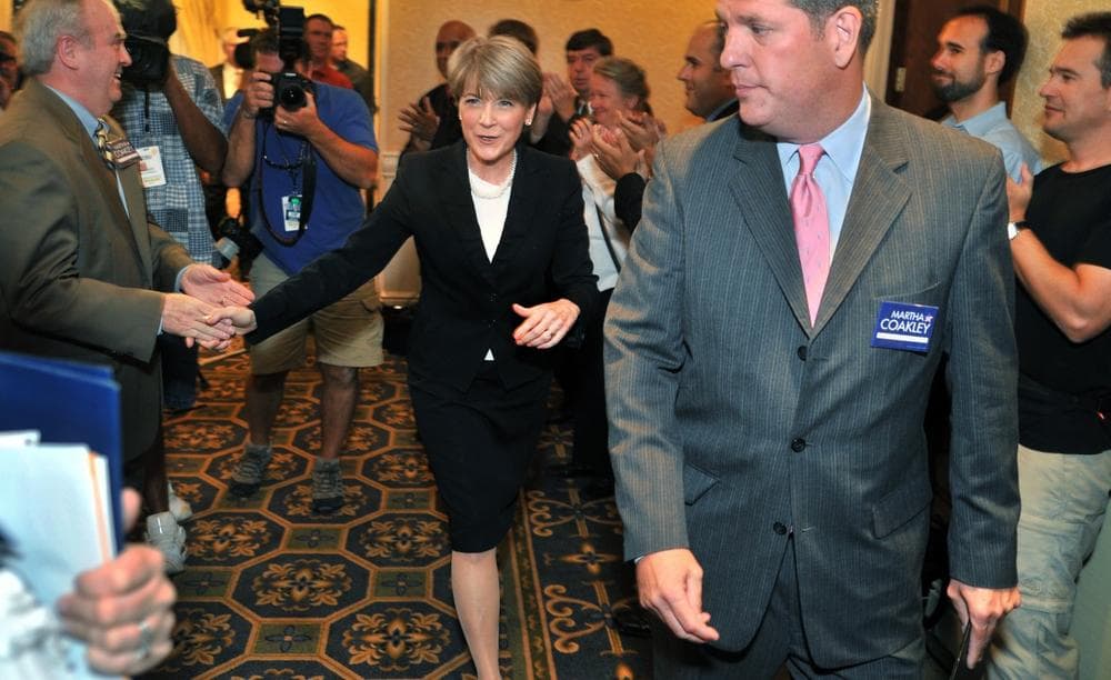 Massachusetts Attorney General Martha Coakley, center, and her husband, retired Cambridge Police Chief Tom O'Connor, right, shakes hands with supporters in Boston, Thursday, Sept. 3, 2009, as she leaves a news conference where she declared herself a Democratic candidate in the special election to succeed the late Sen. Edward M. Kennedy. (AP)