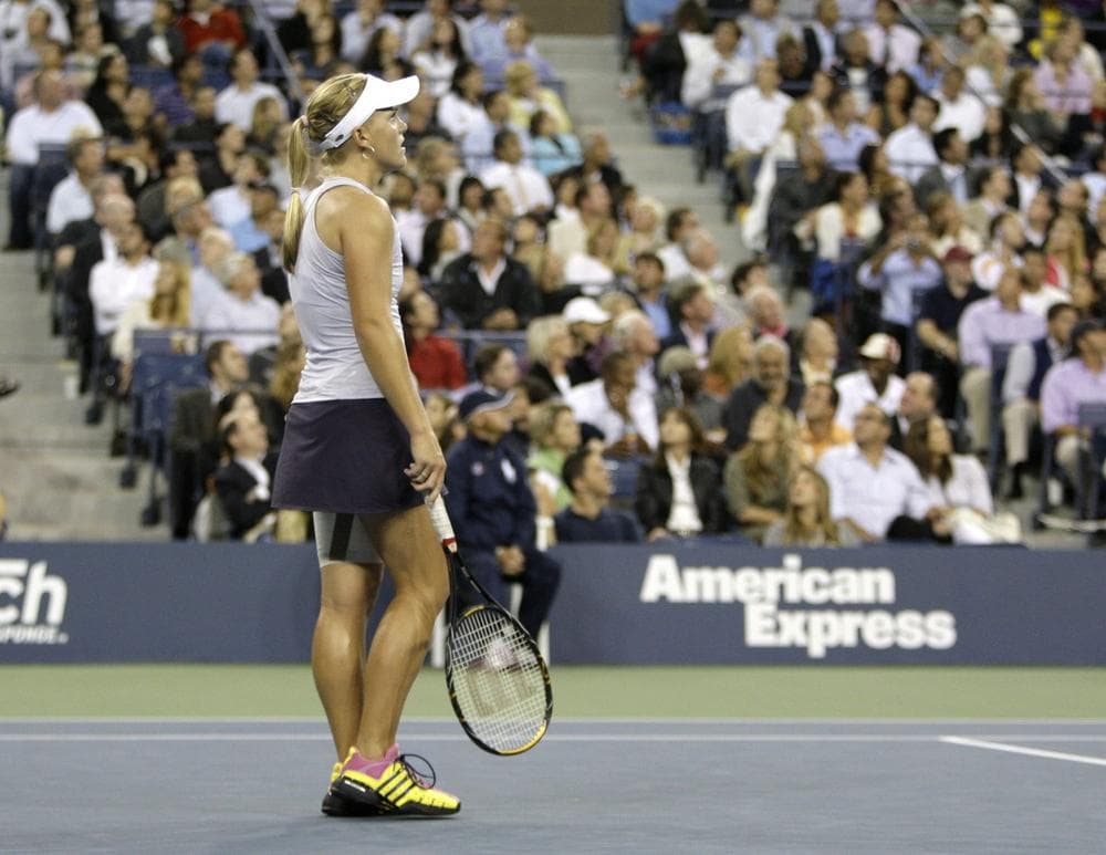 Melanie Oudin, in her signature shoes, pauses during her match against Caroline Wozniacki, of Denmark, at the U.S. Open tennis tournament in New York on Wednesday. 