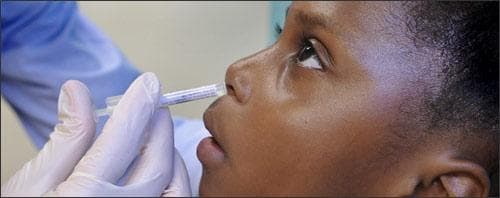 Asia Johnson receives an intranasal H1N1 vaccine, Boston, Oct. 9, 2009. (AP)