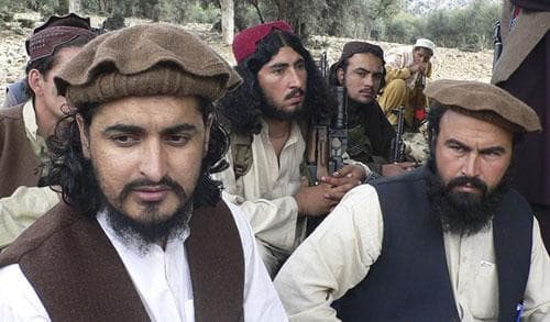 In this photo taken Sunday, Oct. 4, 2009, new Pakistani Taliban chief Hakimullah Mehsud, left, sits with his comrade Waliur Rehman during his meeting with media in Sararogha of Pakistani tribal area of South Waziristan along the Afghanistan border. (AP)