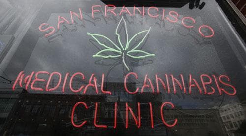 A neon sign is shown at the entrance to the San Francisco Medical Cannabis Clinic in San Francisco, Monday, Oct. 19, 2009. Pot-smoking patients or their sanctioned suppliers should not be targeted for federal prosecution in states that allow medical marijuana, prosecutors were told in a new policy memo issued by the Justice Department. (AP)