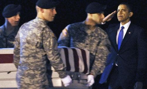 President Barack Obama salutes as the remains of Army Sgt. Dale R. Griffin of Terre Haute, Ind., are carried from a plane at Dover Air Force Base on Thursday morning, Oct. 29, 2009.  According to the Department of Defense, Sgt. Griffin died in Afghanistan. (AP)