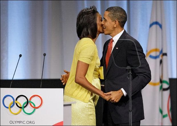President Obama greets his wife Michelle after she made an address during the Chicago 2016 bid presentation at the 121st International Olympic Committee session in Copenhagen. (Matt Dunham/AP)
