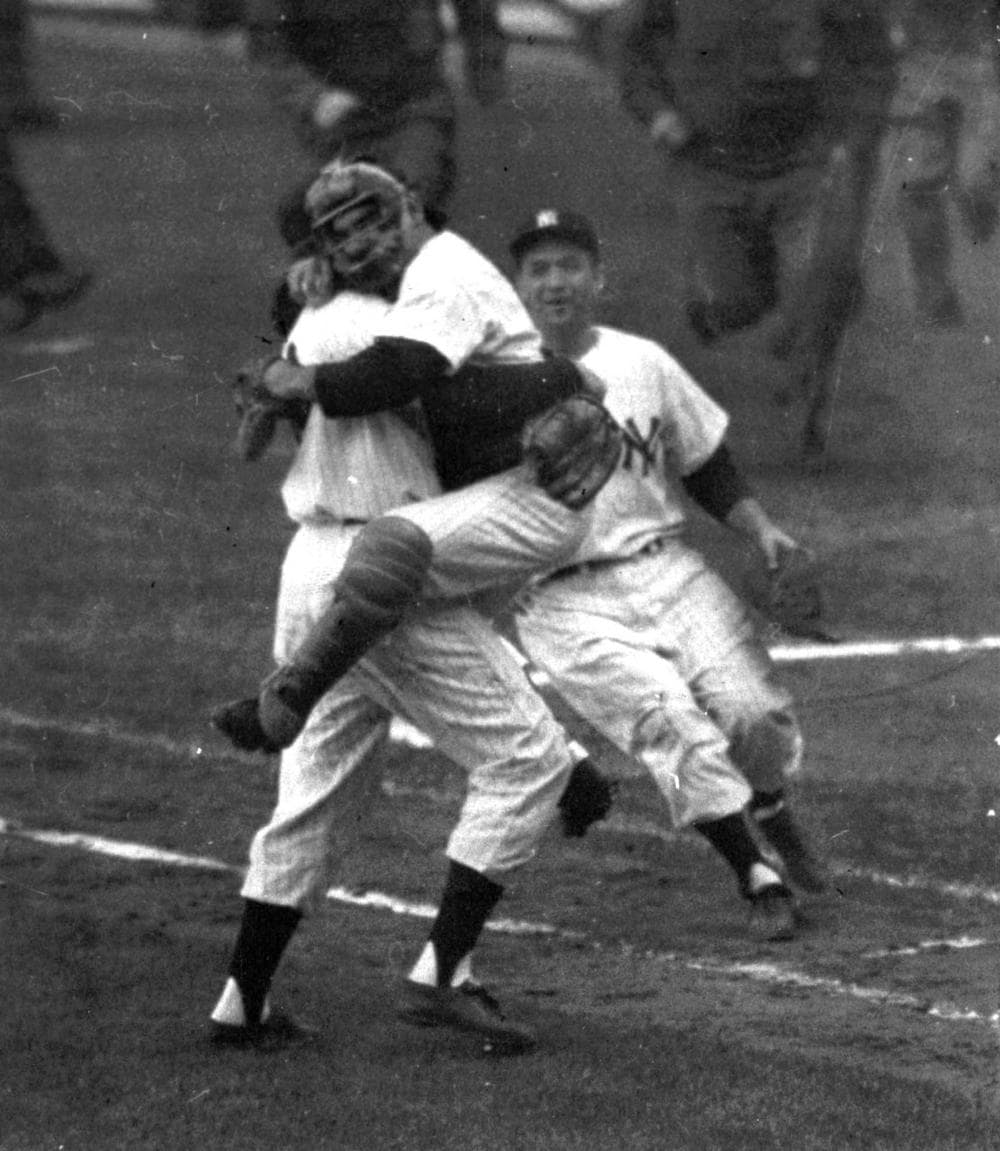 Yankees catcher Yogi Berra is embraced by Don Larsen at the end of Game 5 of the World Series, Oct. 8, 1956. Larsen had pitched a perfect game against the Brooklyn Dodgers. (AP)