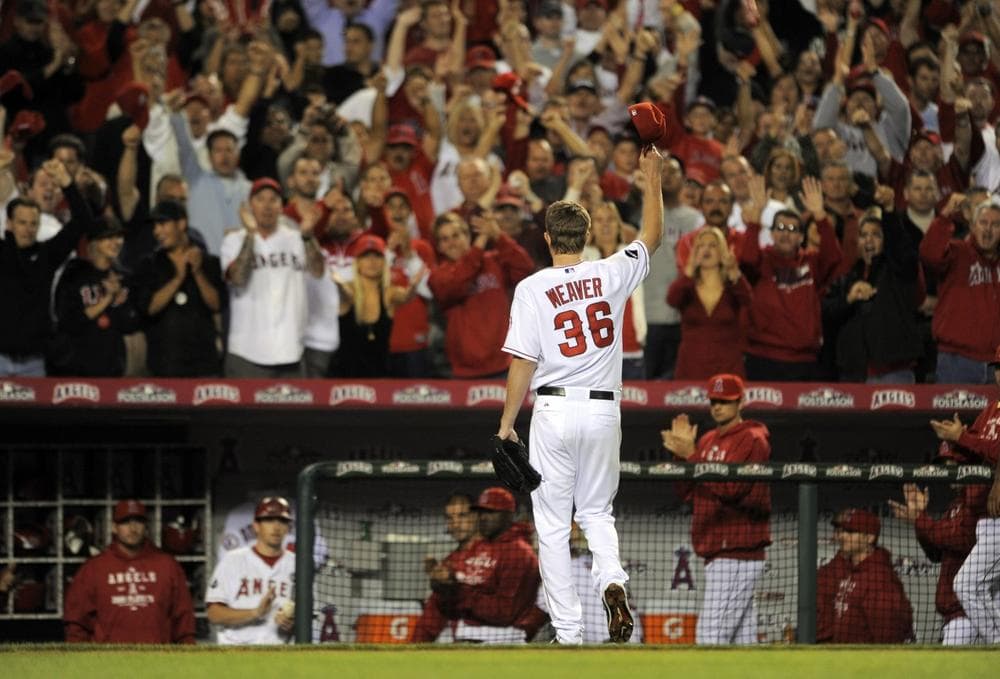 Angels starting pitcher Jered Weaver waves to the cheering crowd as he leaves the game in the eighth inning with a 4-1 lead against the Red Sox in Game 2 of the American League division baseball series Friday,  in Anaheim, Calif. (AP/Chris Carlson)