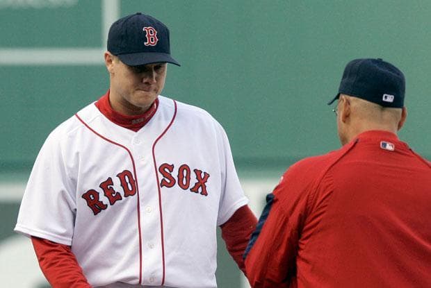 Red Sox closer Jonathan Papelbon is removed by manager Terry Francona in the ninth inning against the Angels at Fenway on Sunday. (Elise Amendola/AP)