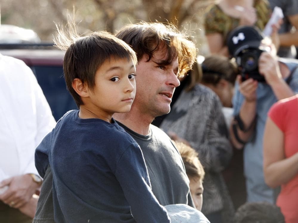 Six-year-old Falcon Heene with his father, Richard, outside the family&#039;s home in Fort Collins, Colo., after Falcon was found hiding in a box in a space above the garage on Thursday. (David Zalubowski/AP)