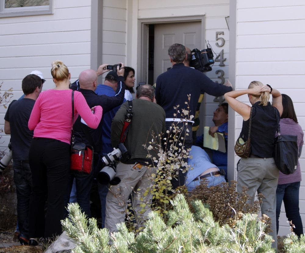 Media gather at the front door of  the home of Richard and Mayumi Heene in Fort Collins, Colo., on Friday.  The parents avoided talking to the media on Friday. (AP/Ed Andrieski)