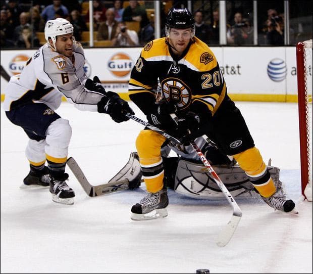 Boston Bruins&#039; Daniel Paille goes for a rebound with Nashville Predators&#039; Shea Weber during the second period on Wednesday. (Winslow Townson/AP)