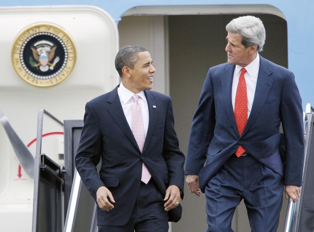 President Obama and Sen. John Kerry arrive at Logan International Airport in Boston on Friday. (AP)