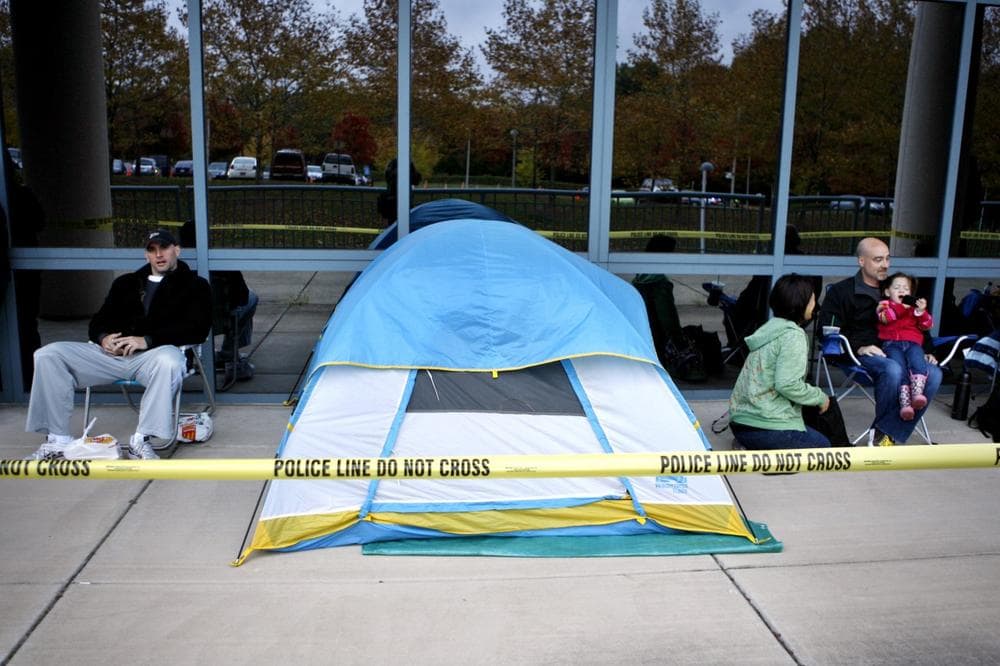 People who stayed over night wait in line to get a free swine flu vaccine at the Fairfax County Government Center in Fairfax, Va., Oct. 24. 