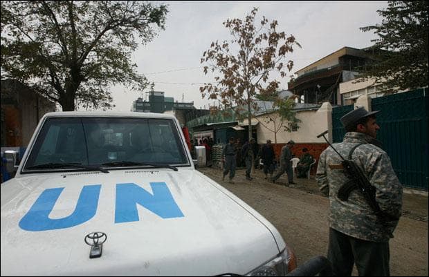 A U.N. vehicle is parked in front of a guest house after an attack in Kabul. (Musadeq Sadeq/AP)