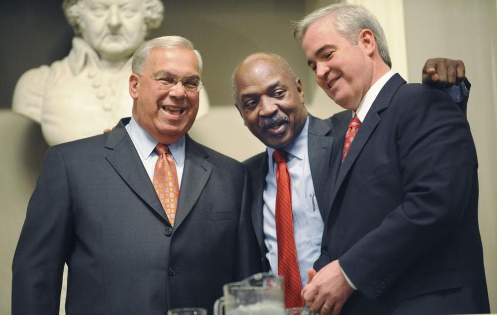 Boston Mayor Thomas Menino, left, stands with Harvard Professor Charles Ogletree Jr., debate moderator, and Michael Flaherty, right, before a mayoral debate at Faneuil Hall on Tuesday. (AP) 