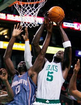 Kevin Garnett and Charlotte Bobcats' Nazr Mohammed battle for the rebound in the first quarter on Wednesday. (Michael Dwyer/AP)