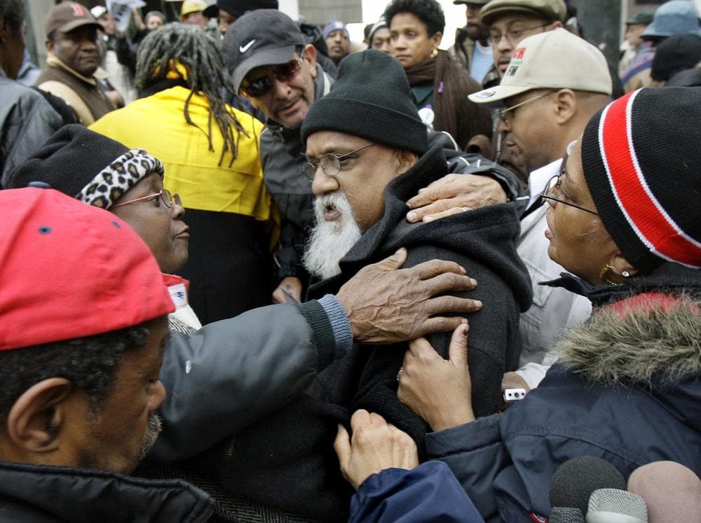 Turner is embraced by supporters after a November news conference in which he accused the media of violating his constitutional rights and of assuming his guilt. (AP)
