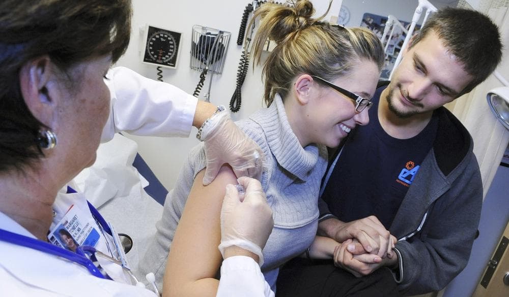 A pregnant patient receives an H1N1 vaccination in obstetrics at Brigham and Women's Hospital on Tuesday in Boston. (AP)