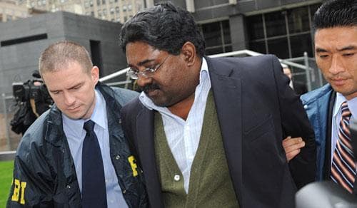 Raj Rajaratnam, billionaire founder of the Galleon Group, a major hedge fund, is led in handcuffs from FBI headquarters in New York on Friday, Oct.16, 2009. Rajaratnam was charged with insider trading in the stock of several companies including Hilton, Clearwire, and Google. (AP)