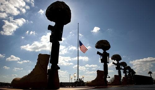Soldiers Cross, honoring those who lost their lives in last week's shooting, is seen near the podium where President Barack Obama will speak at the memorial service, Tuesday, Nov. 10, 2009, at Fort Hood, Texas. (AP)
