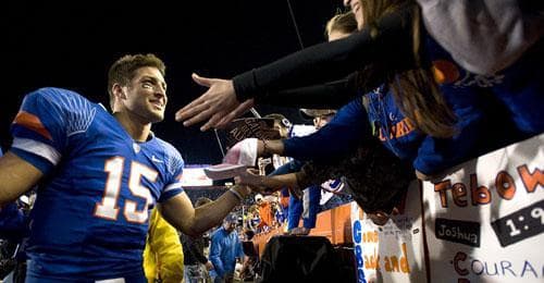 Florida quarterback Tim Tebow makes the trip around the Swamp greeting fans for the last time after Florida defeated Florida State in Gainesville, Fla., Saturday, Nov. 28, 2009. (AP)