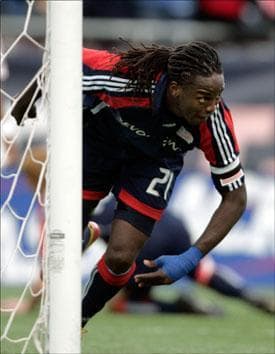 Shalrie Joseph celebrates his goal against the Chicago Fire during the second half the game on Sunday. (Adam Hunger/AP)