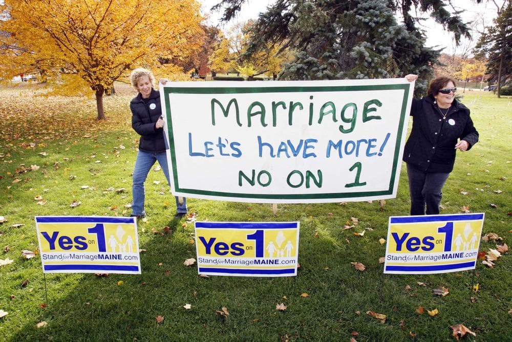Supporters of same-sex marriage Suzanne Blackburn, left, and Ann DiMella, of Portland, Maine, prepare to set up a &quot;No on 1&quot; sign on Tuesday (Robert F. Bukaty/AP)