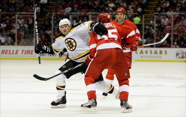 Bruins Michael Ryder skates around Detroit Red Wings defender Niklas Kronwall in the second period of a game on Tuesday. (Paul Sancya/AP)
