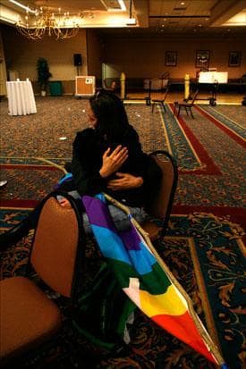 Friends console one another after learning about the unofficial defeat on Question 1 at an empty election night headquarters in Portland, Maine. (Pat Wellenbach/AP)