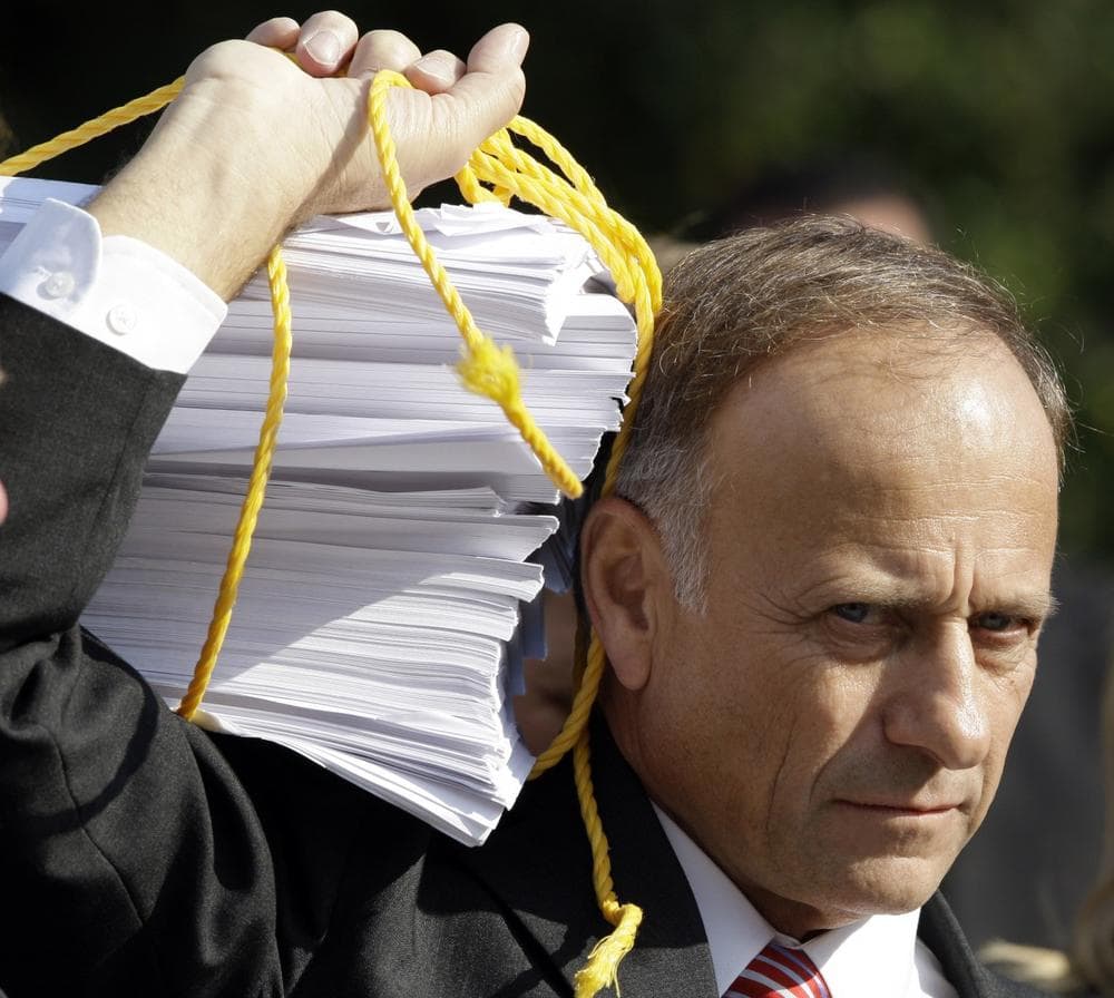 Rep. Steve King, R-Iowa, holds a copy of the health care bill. (AP)