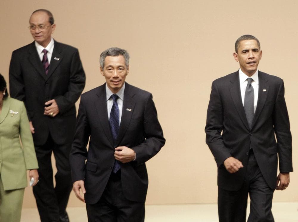 From left to right, Myanmar&#039;s Prime Minister Gen. Thein Sein, Singaporean Prime Minister Lee Hsien Loong and U.S. President Barack Obama, prepare to take their seats for a multilateral meeting with ASEAN-10 members in Singapore, Sunday. (AP Photo/Pablo Martinez Monsivais)