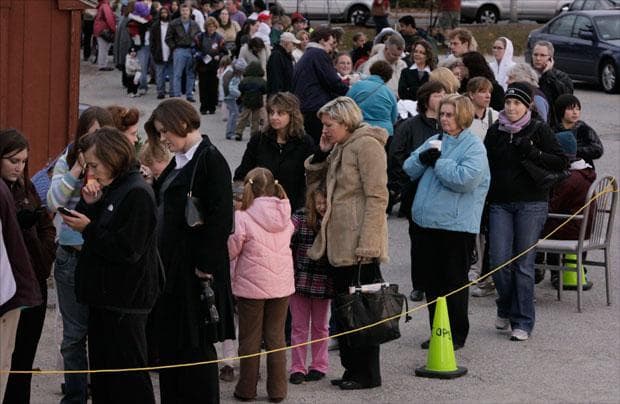 People wait in line outside a clinic set up for Swine Flu inoculations in Worcester, Mass. on Nov. 2. (Steven Senne/AP)