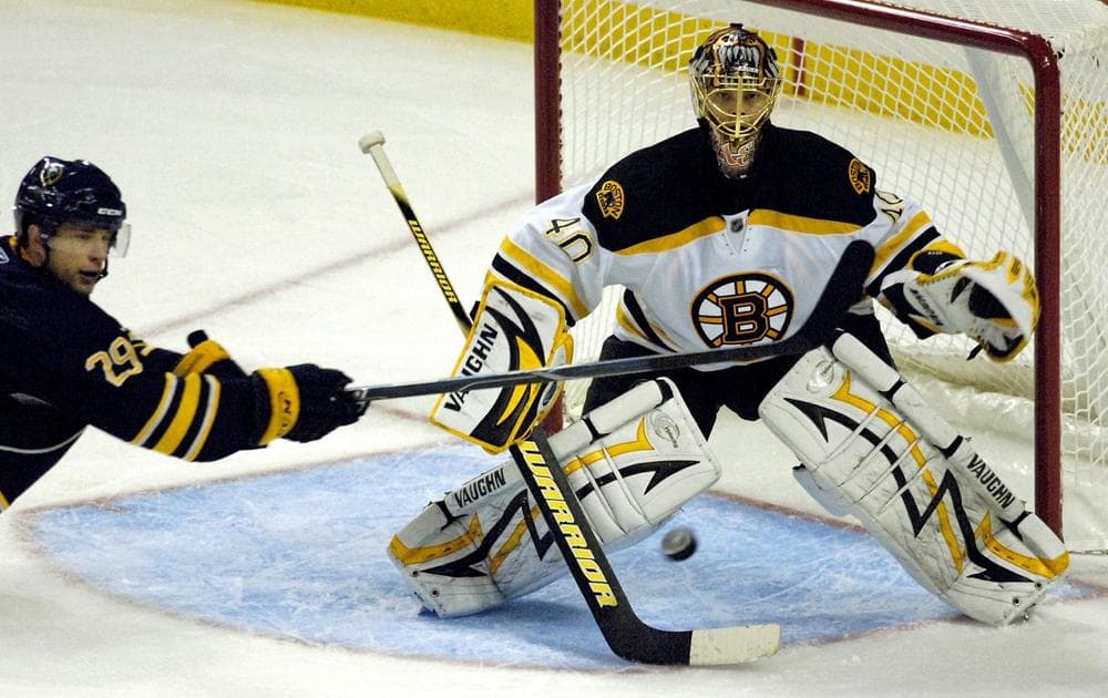 Sabres&#039;  Jason Pominville, left, looks to redirect a shot at Bruins goalie Tuukka Rask during the third period in Buffalo, N.Y., Friday.  (AP Photo/Don Heupel)