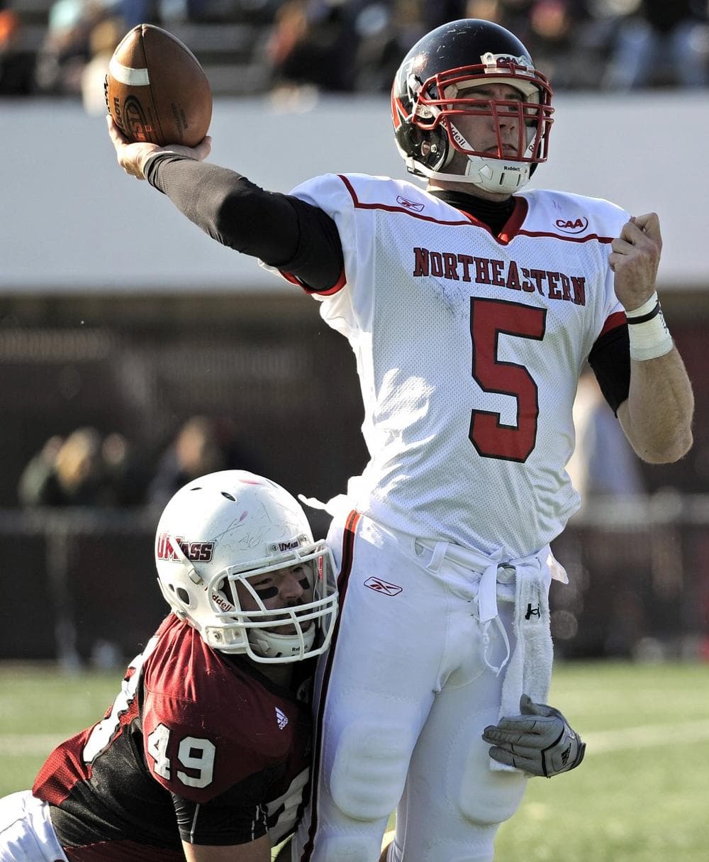 Northeastern quarterback Alex Dulski is sacked during the first half of an NCAA game earlier this month. Northeastern is dropping its football program after 74 years, saying it's too expensive to maintain. (AP) 