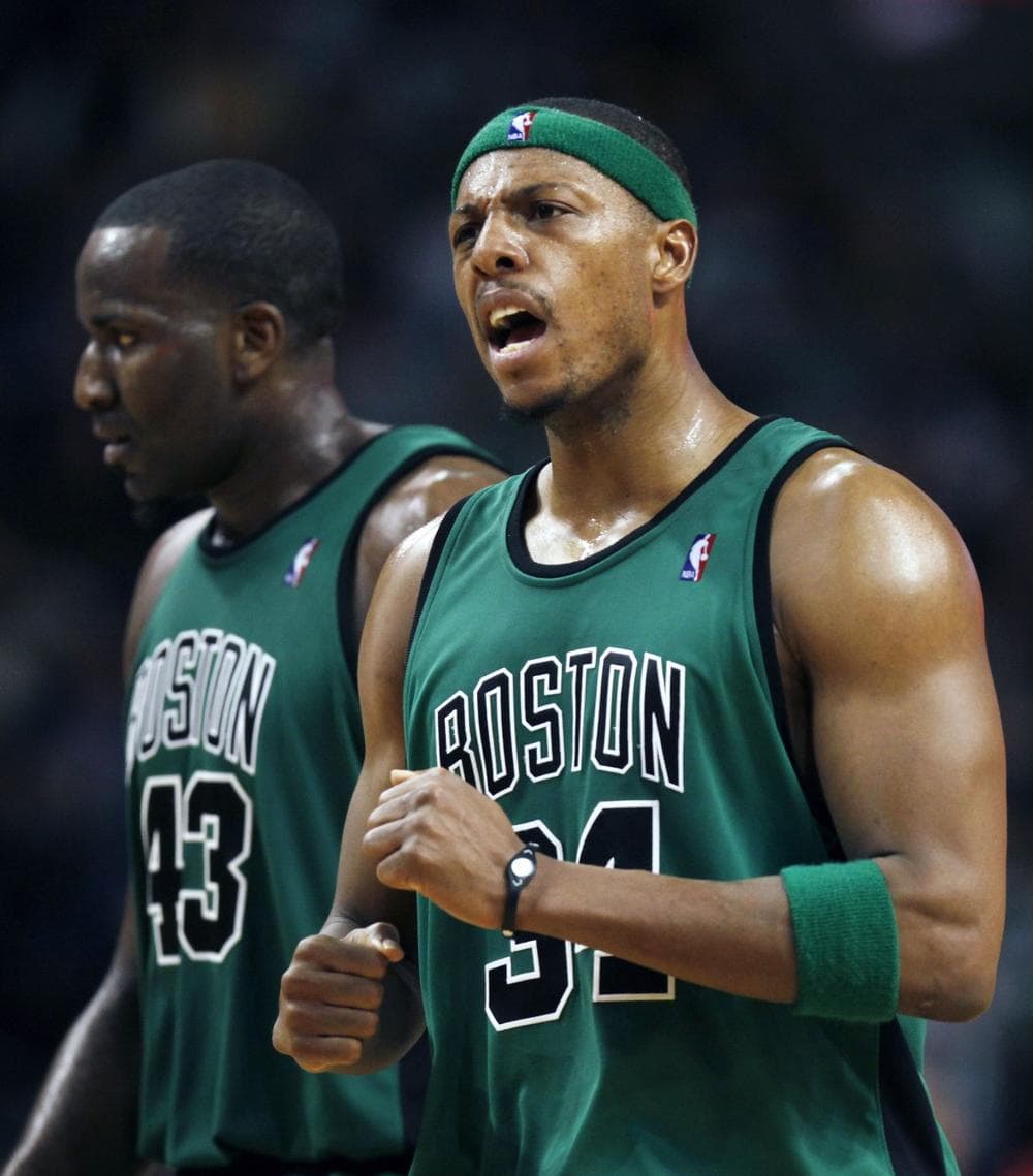 Celtics&#039; Paul Pierce, right, reacts after a Celtics score, next to Kendrick Perkins in the third quarter against the Raptors, Friday in Boston.  (AP Photo/Michael Dwyer)
