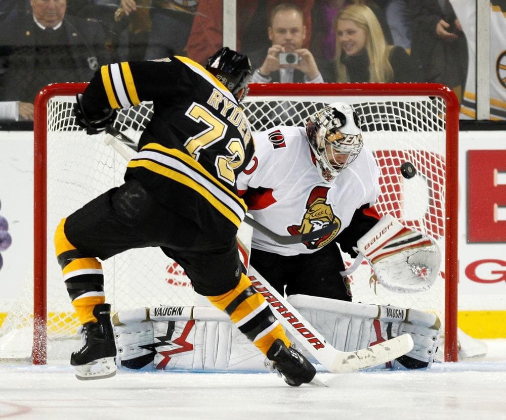 Bruins&#039; Michael Ryder makes the only goal scored in the shootout on Ottawa Senators&#039; Brian Elliott, Saturday, in Boston.  (AP Photo/Michael Dwyer)