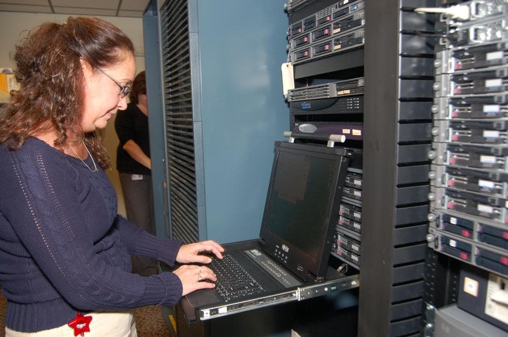 An IT worker at the Spencer-based manufactor Flexcon maintains computer systems critical to company operations. (Courtesy of Flexcon).