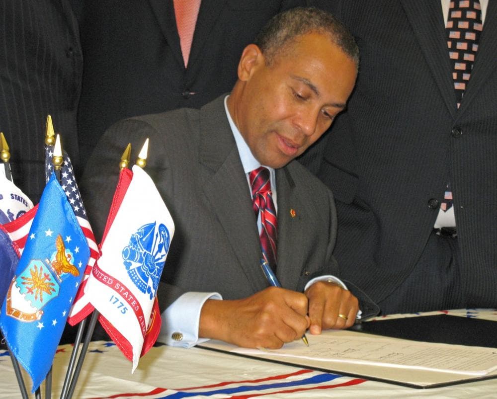 Gov. Deval Patrick signed the bill as a &quot;small gesture of our profound thanks.&quot; (Meghna Chakrabarti/WBUR)