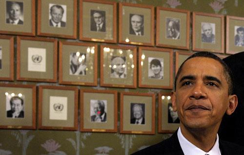 President Barack Obama sits in front of framed photos of previous Nobel Peace Prize winners at the Norwegian Nobel Institute in Oslo, Norway, on Thursday, Dec. 10, 2009. (AP) 