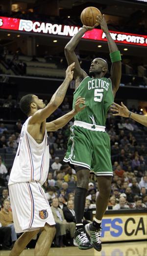 Kevin Garnett shoots over Charlotte Bobcats&#039; Tyson Chandler in the second half of the Celtics&#039; 108-90 win on Tuesday. (Chuck Burton/AP)
