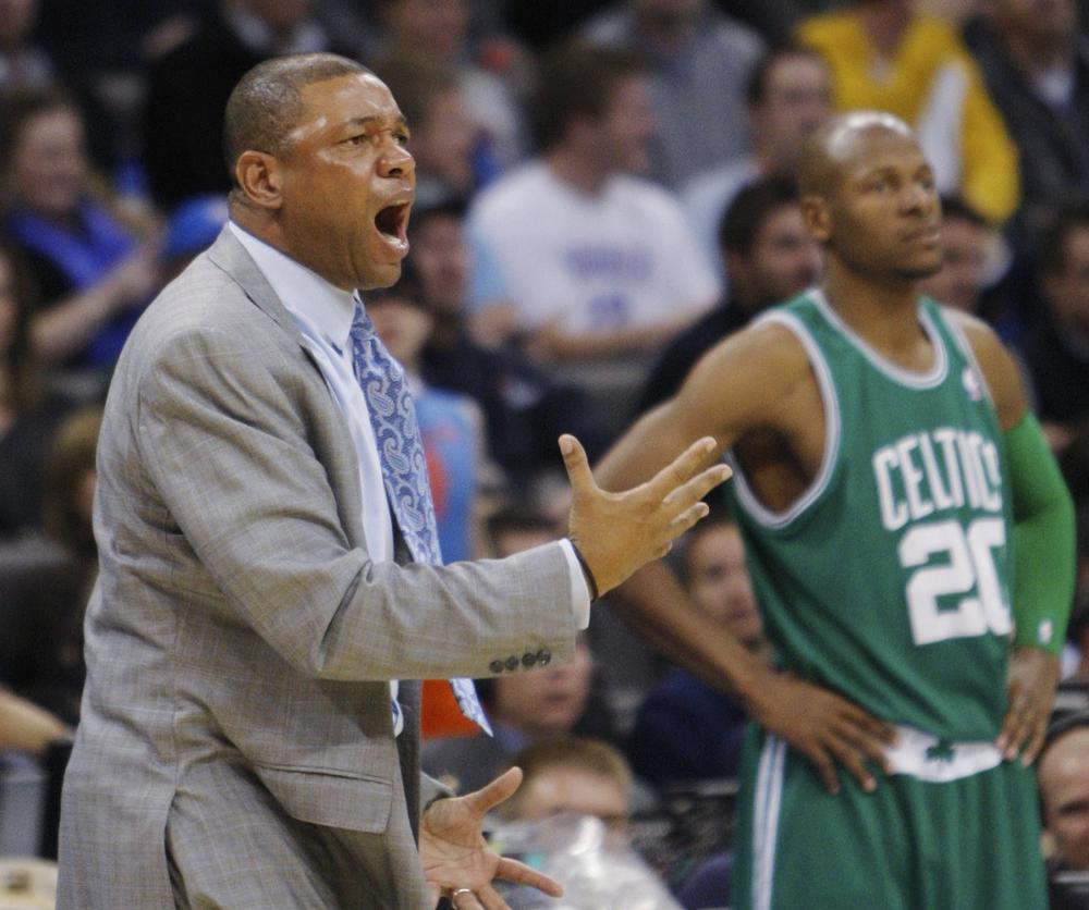 Celtics head coach Doc Rivers, left, shouts at an official during the fourth quarter in Oklahoma City, Friday. Celtics guard Ray Allen, right, looks on.  (AP Photo/Sue Ogrocki)